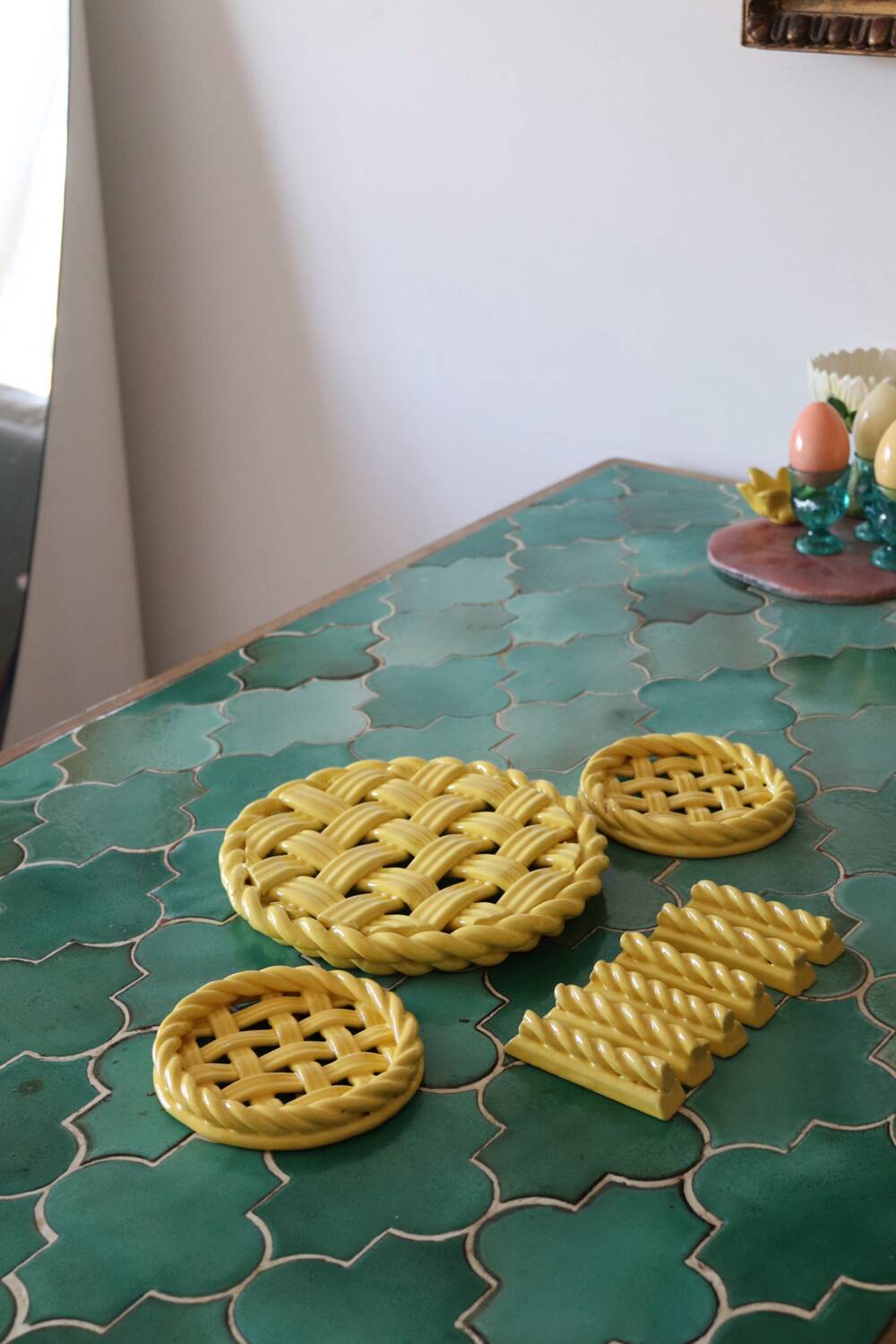 2 yellow ceramic trivets and knife rests