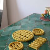 2 yellow ceramic trivets and knife rests