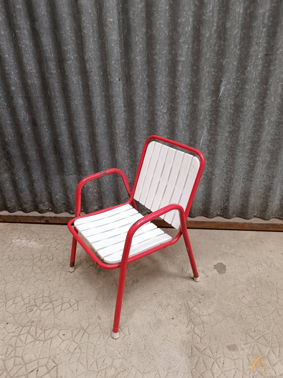 Red metal children's garden armchair