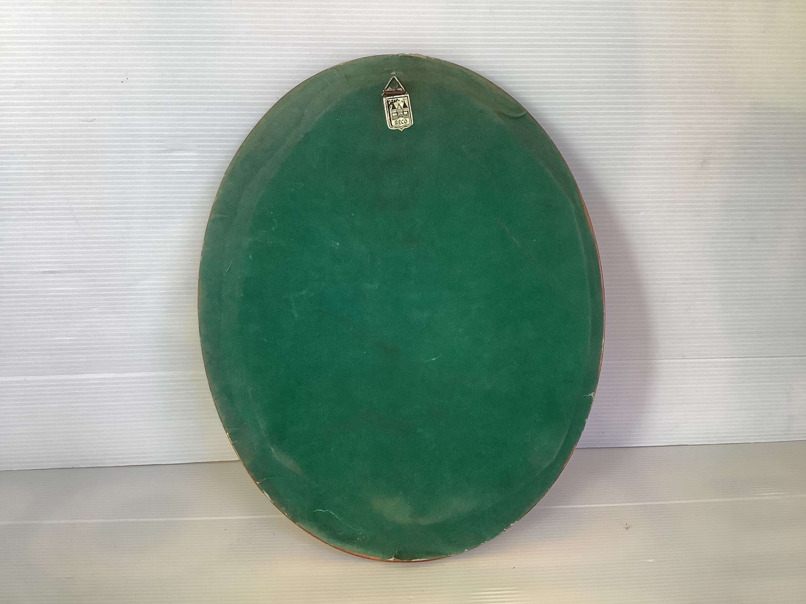 Golden oval frame dried flowers