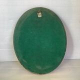 Golden oval frame dried flowers