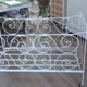 Wrought iron baby bed. Or bench seat of your choice
