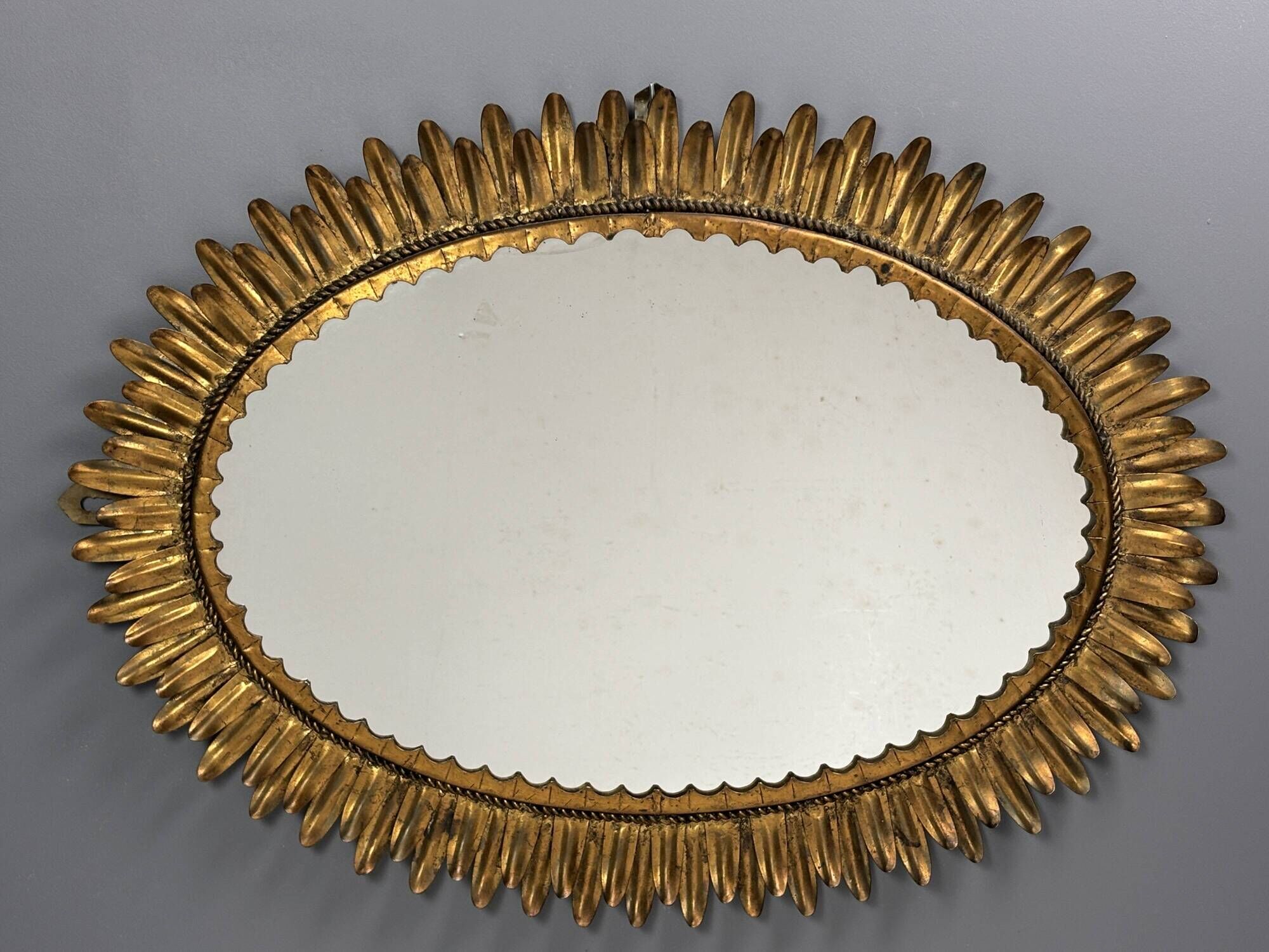 Midcentury bohemian Hollywood Regency Spanish gilt metal sun mirror, 1960s