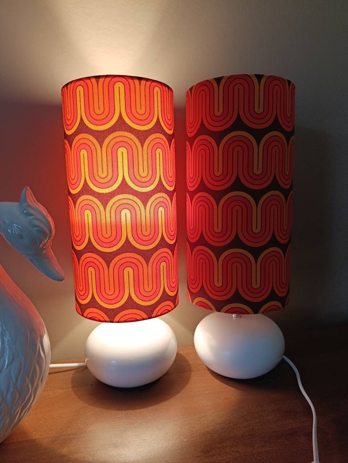 Two lamps with a seventies psychedelic wave print.