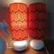 Two lamps with a seventies psychedelic wave print.