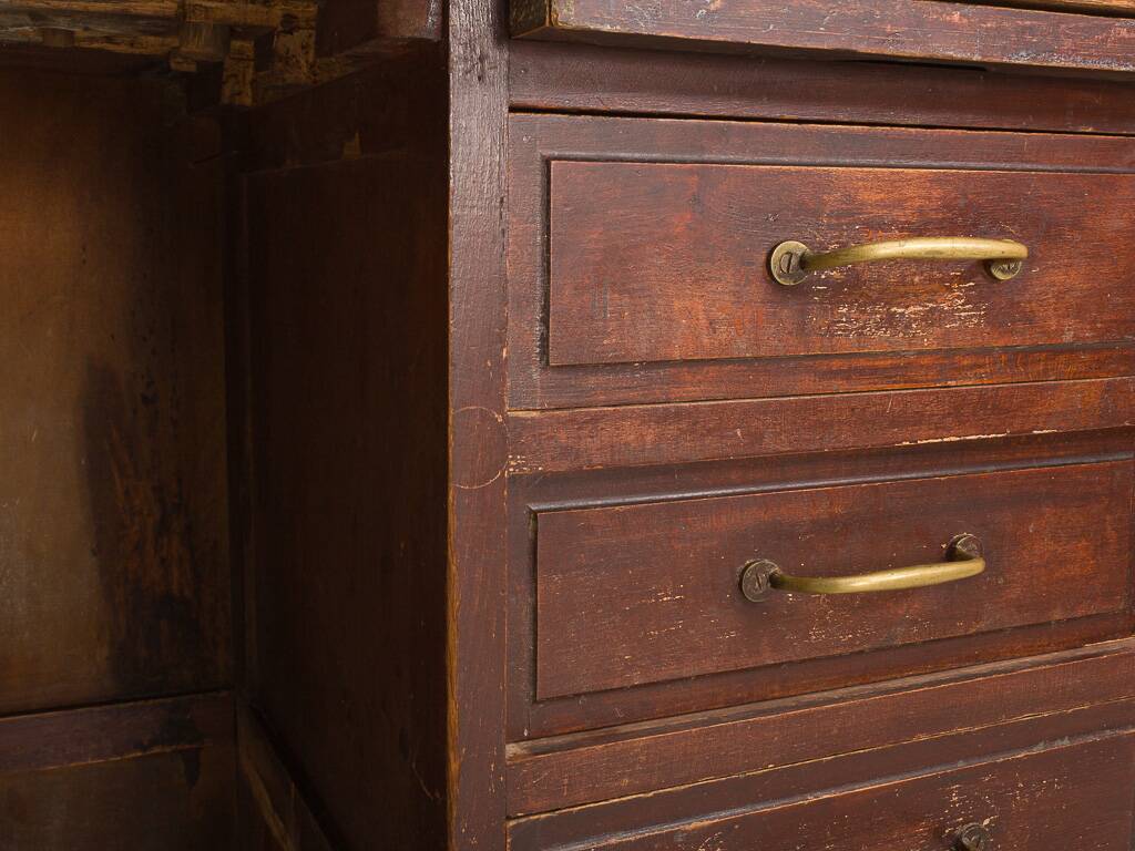 Small vintage stained wooden countertop with 2 shelves and 10 drawers