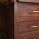 Small vintage stained wooden countertop with 2 shelves and 10 drawers