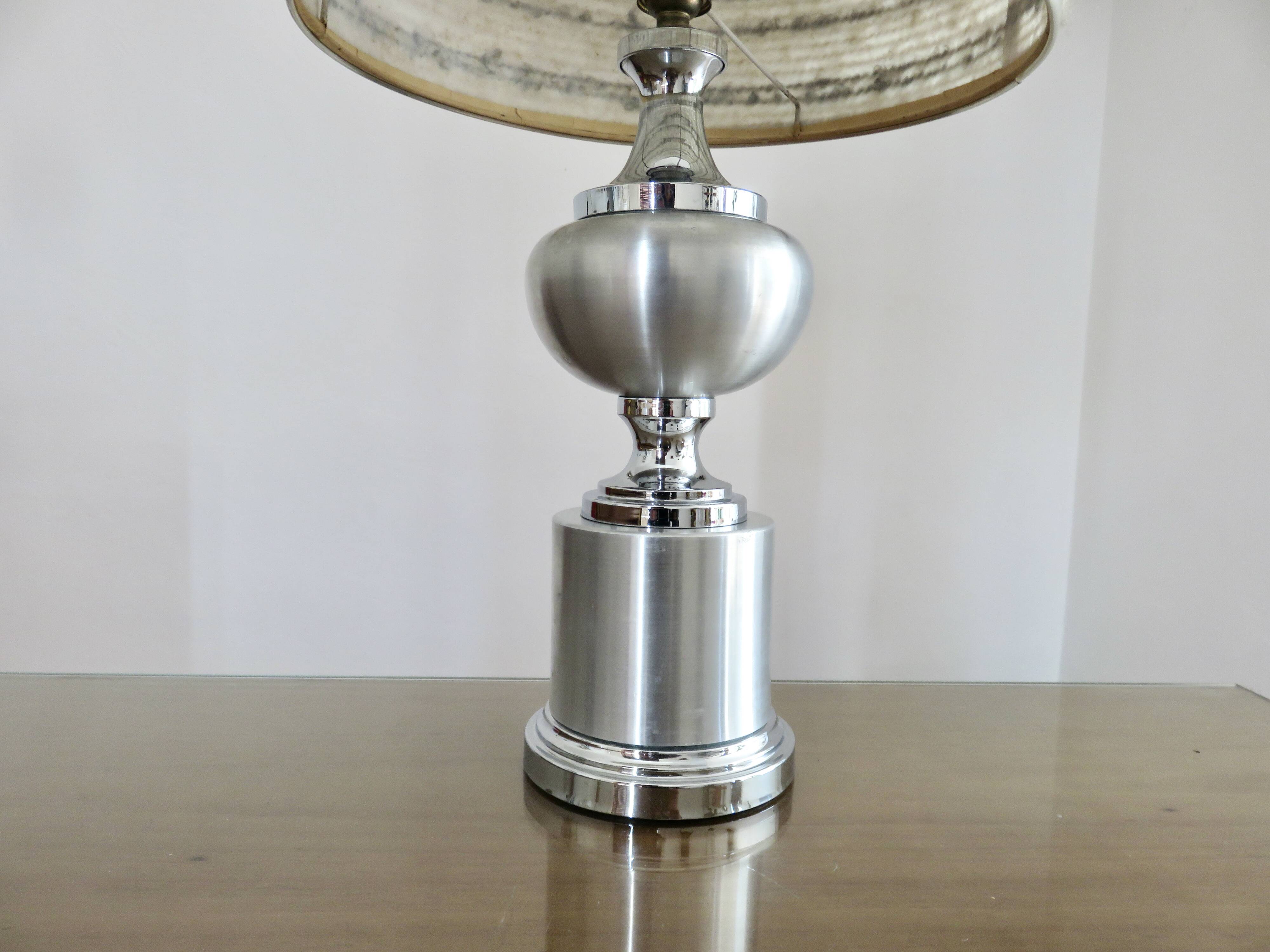 Brushed aluminum and chrome lamp typical of the 70s