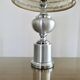 Brushed aluminum and chrome lamp typical of the 70s