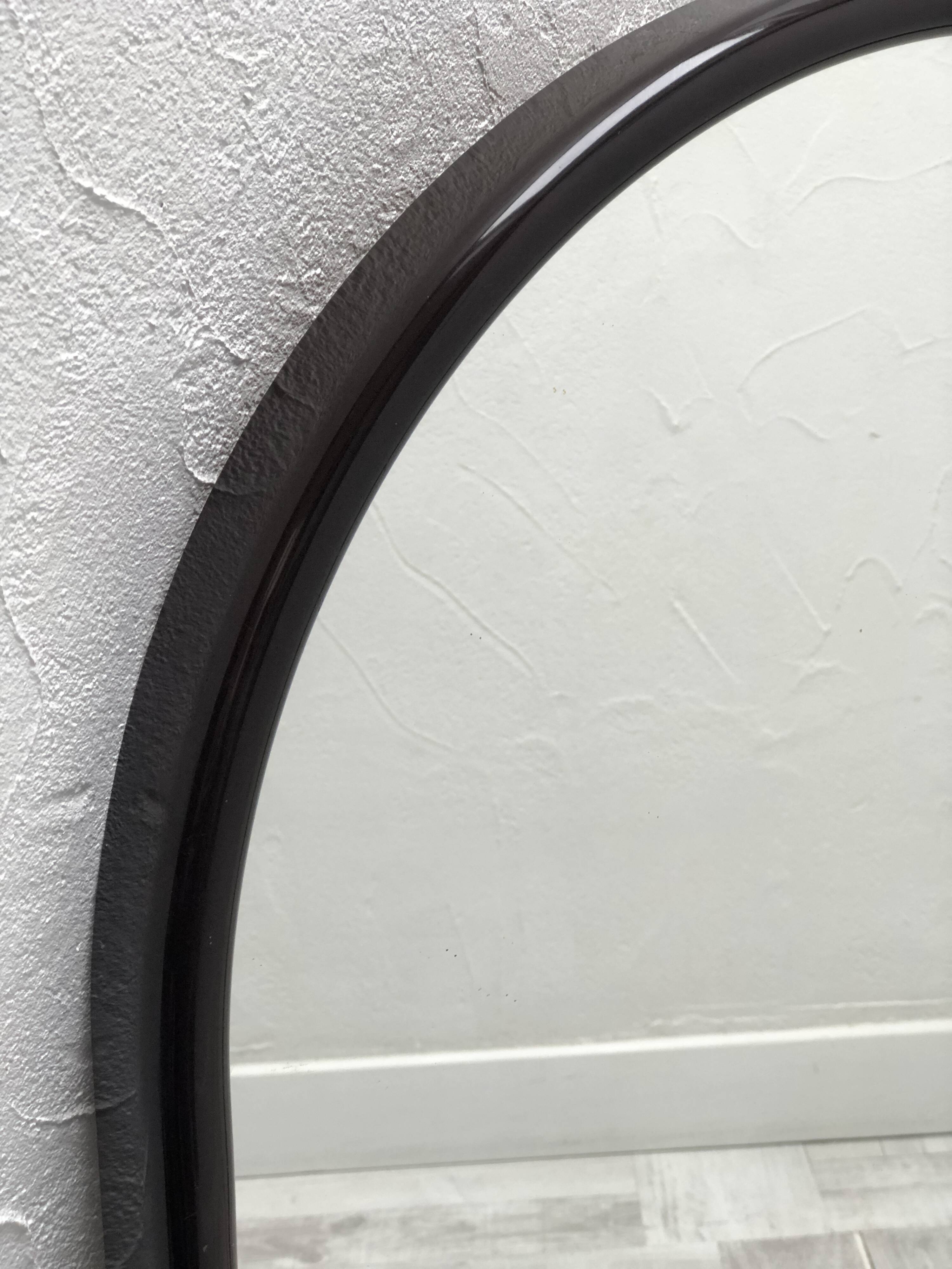 Brown plastic oval mirror, 1960s/1970s