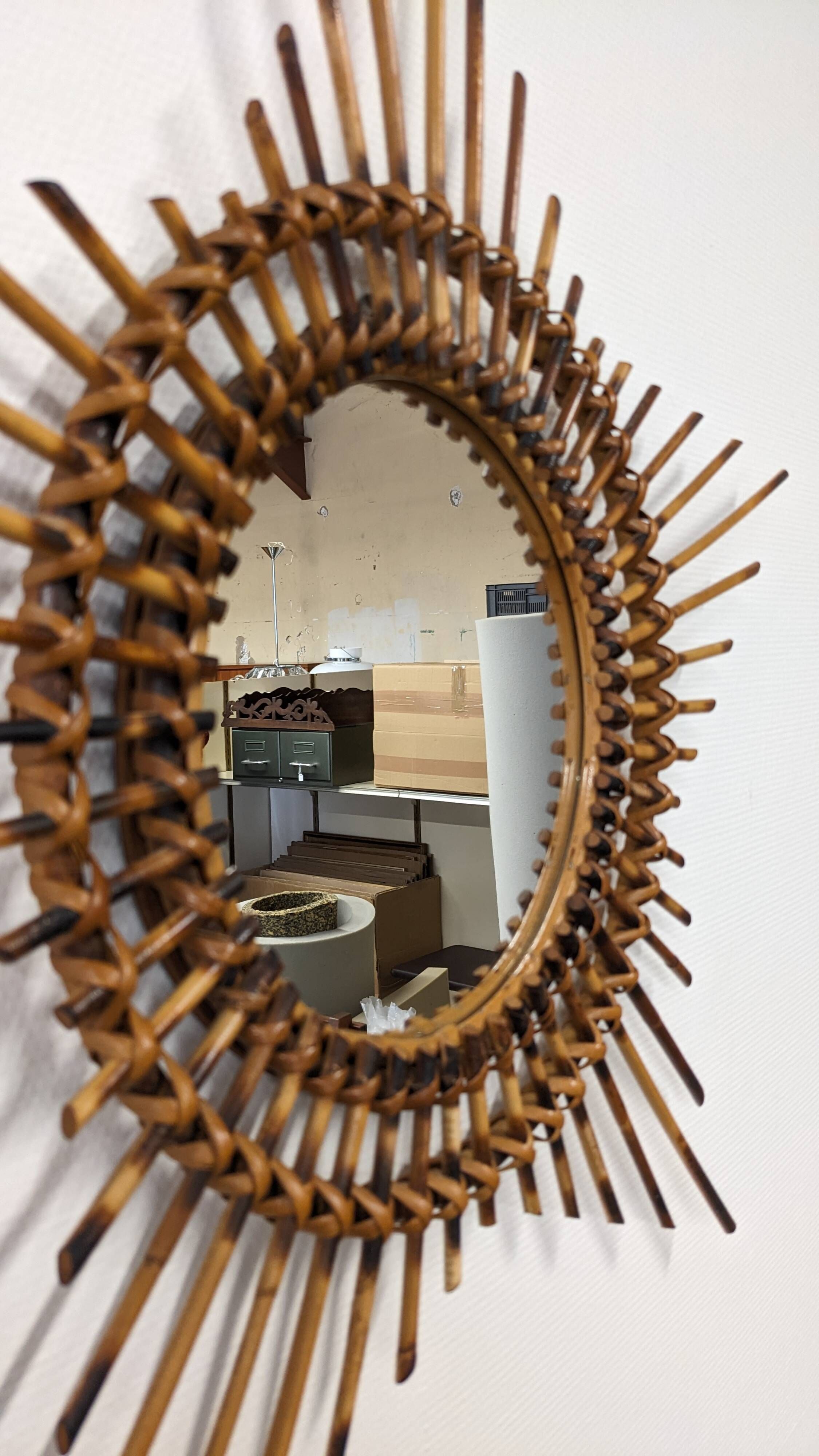 Starry sun mirror in rattan, France around 1960.