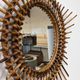 Starry sun mirror in rattan, France around 1960.