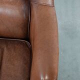 Cognac brown cow leather armchair with decorative nail finish
