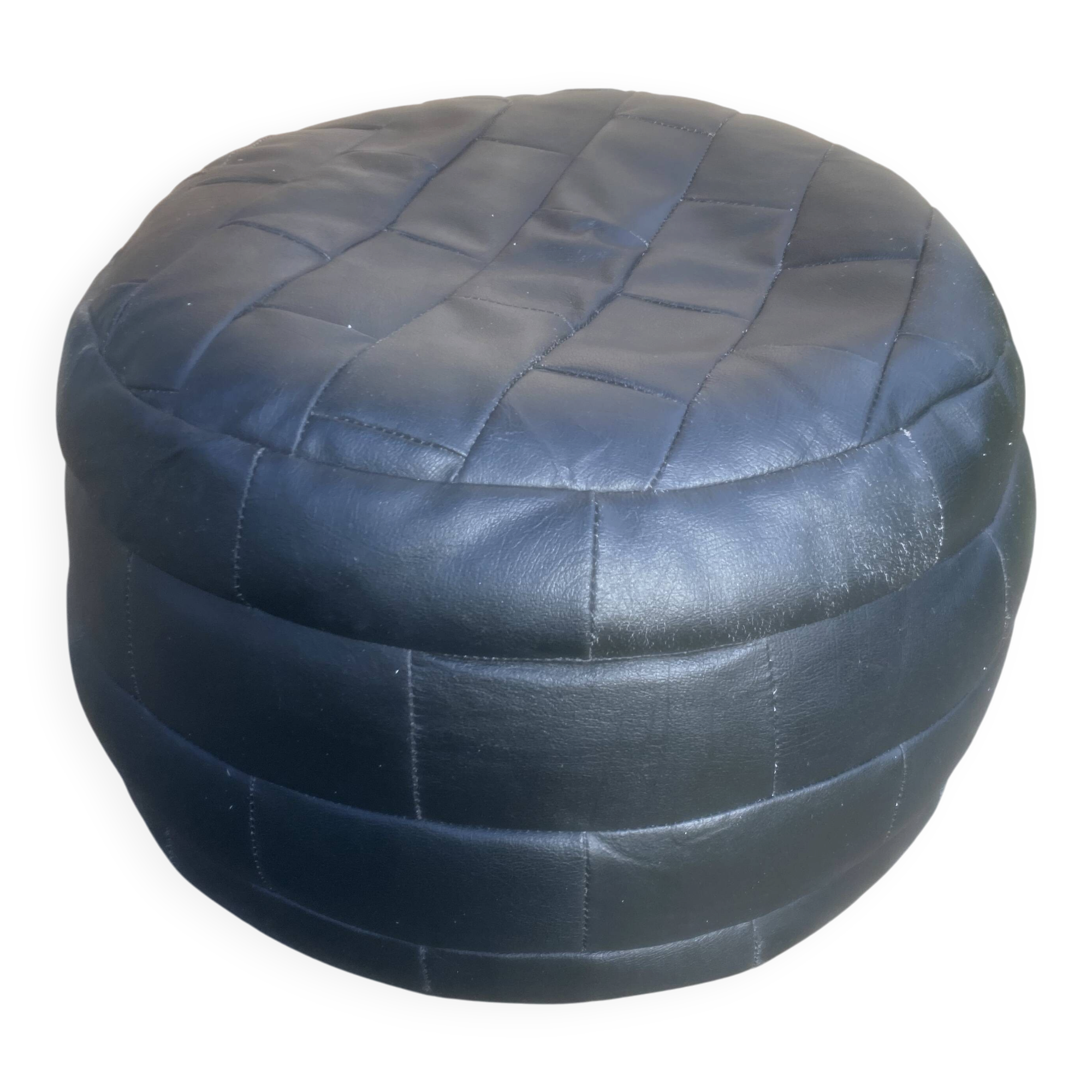 Black leather patchwork pouf by De Sede