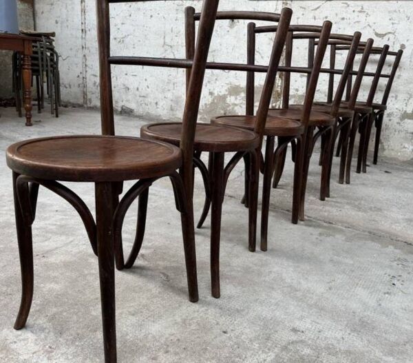 Série de 7 anciennes chaises bistrot Baumann bois courbé assise ronde