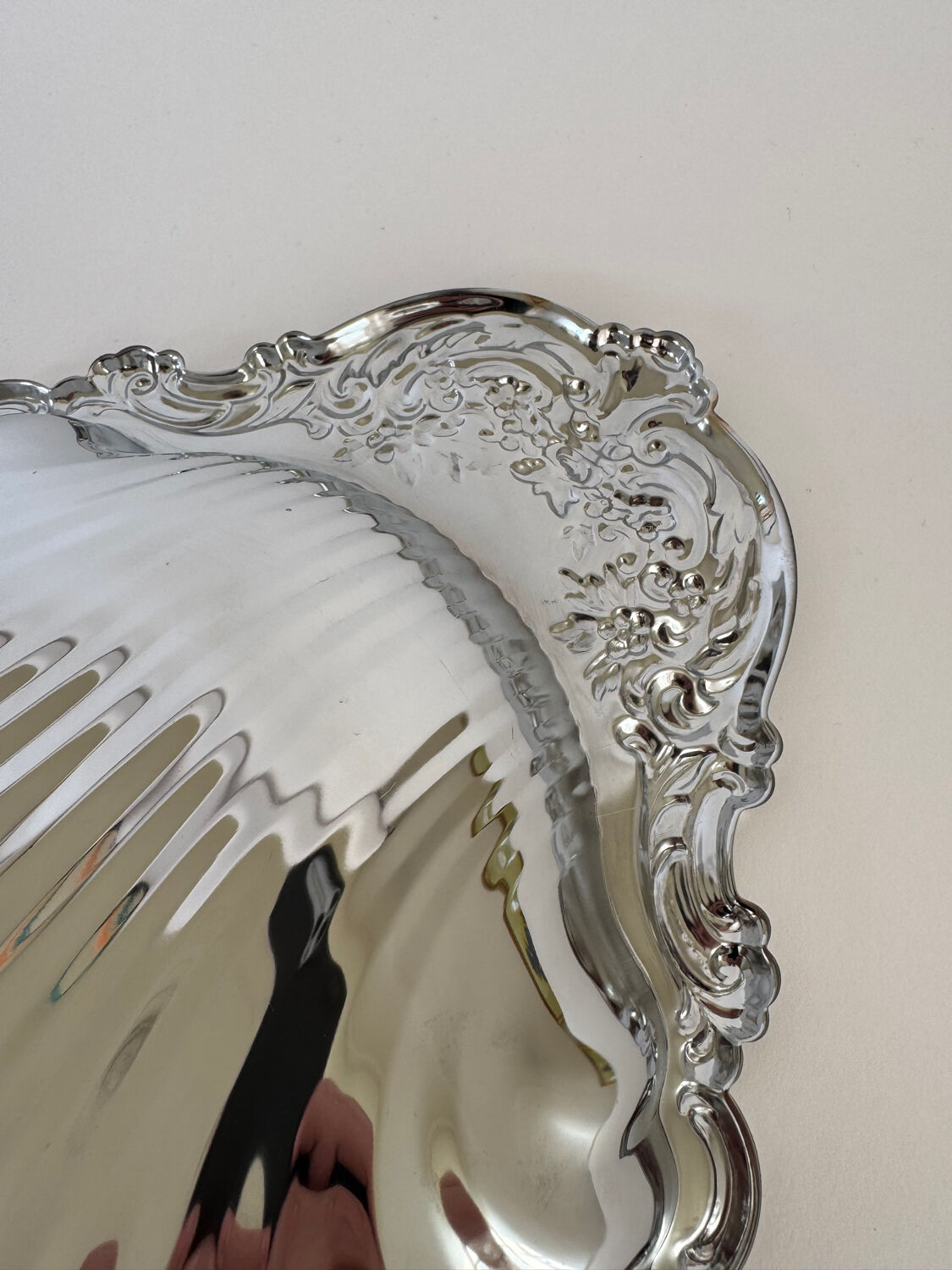 Large silver-plated serving dish in the shape of a vintage shell.