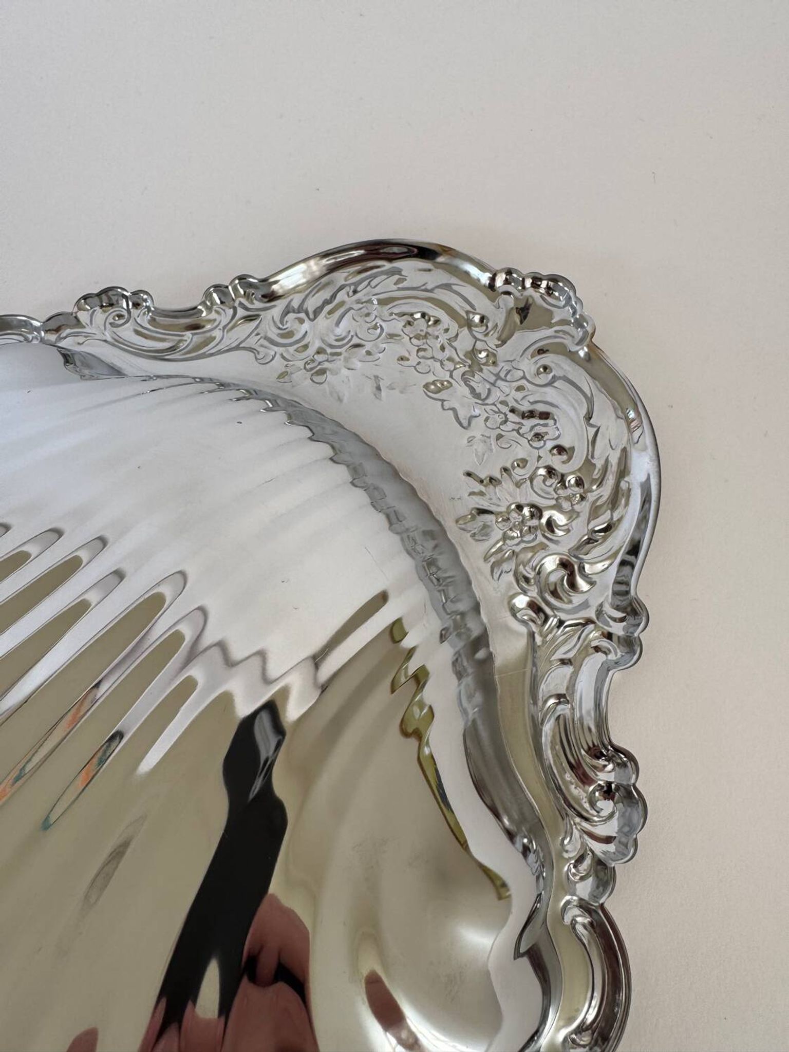 Large silver-plated serving dish in the shape of a vintage shell.