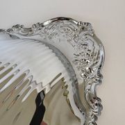Large silver-plated serving dish in the shape of a vintage shell.