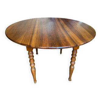 Louis philippe round table in cherry with two extensions with turned legs early 20th century