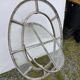 Bull's-eye window from the 19th century in iron (with opening).