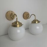 A pair of vintage opaline and brass wall lights