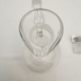 small glass decanter with its handle and spout
