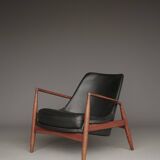 Fauteuil Seal en cuir et teck Ib Kofod-Larsen pour OPE, Suède, années 1960.