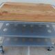 Metallic trolley with wheels, 3 levels with wooden top.