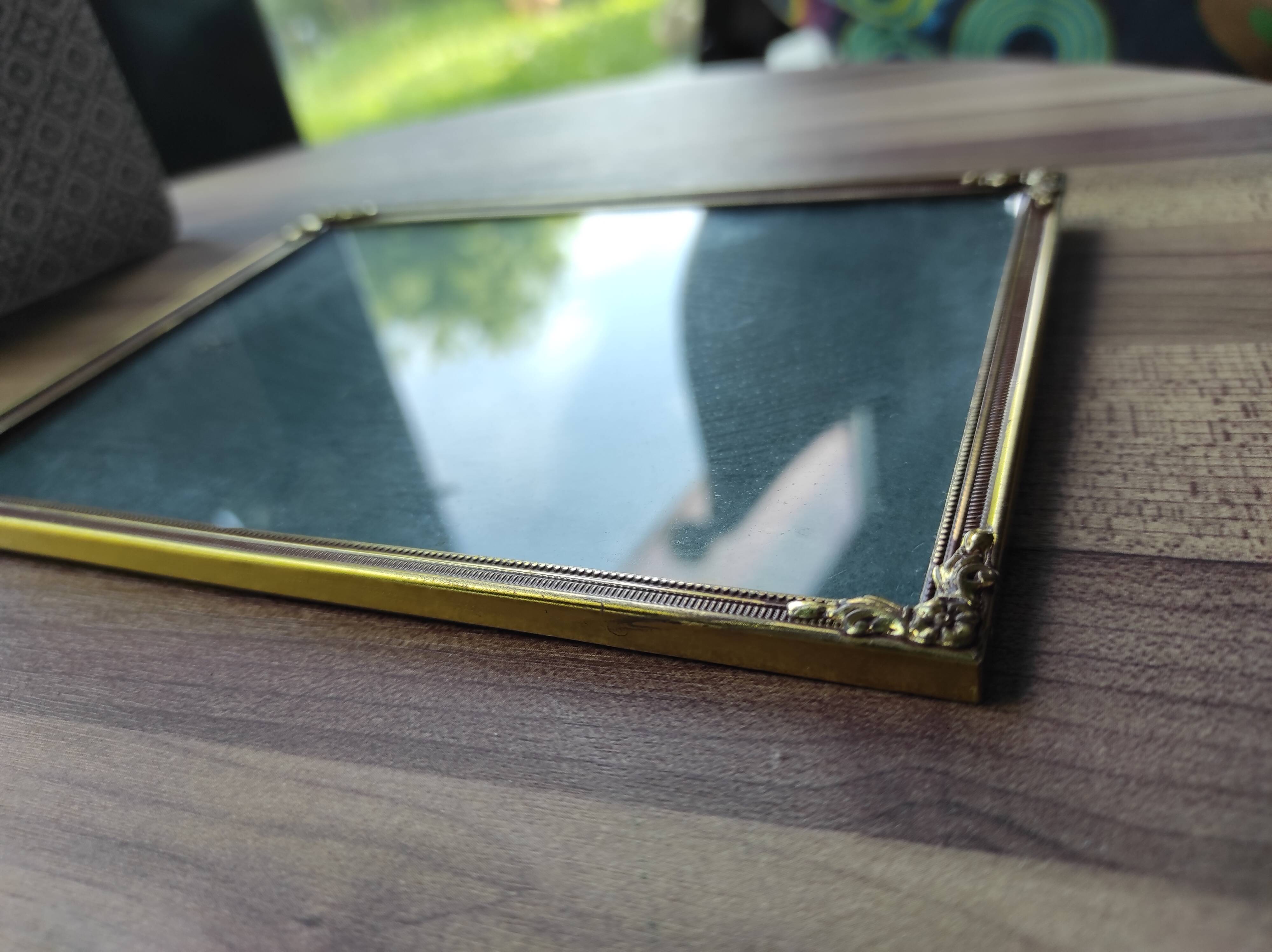 Vintage photo frame in gold and decorated metal