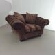 Large weighty love seat with the original matching cushions. Marked "Handmade in Holland"