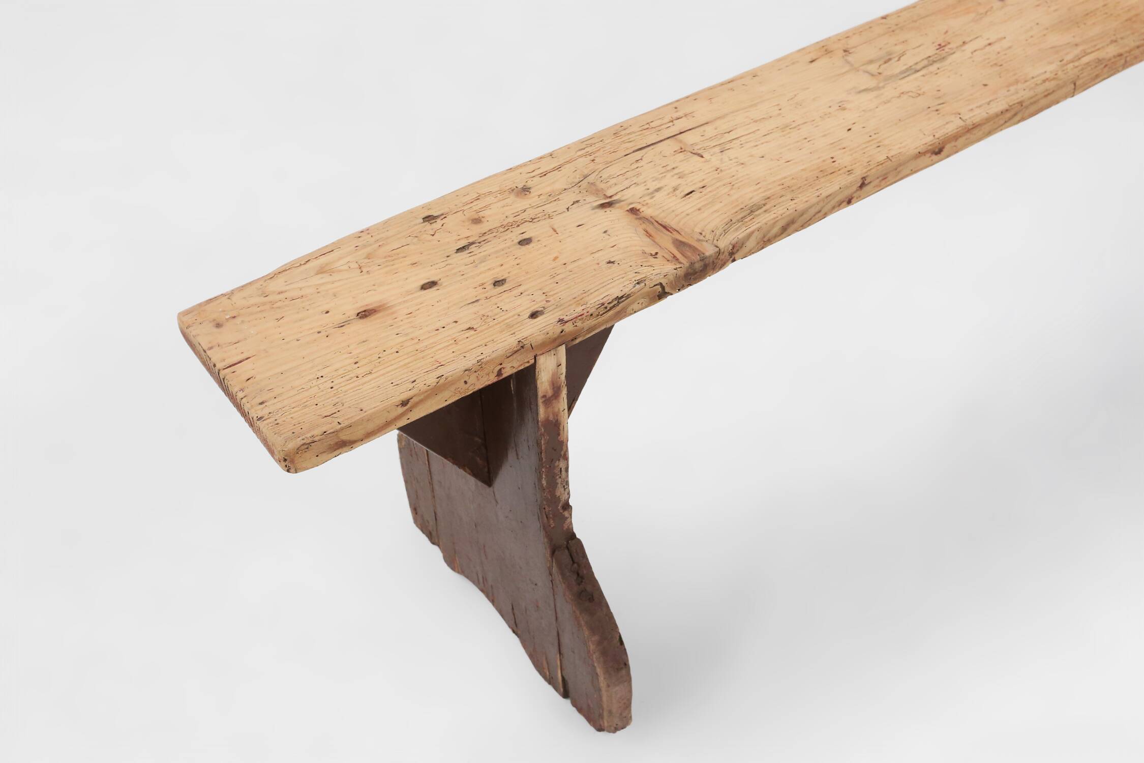 Rustic wooden bench in with brown painted feet, France ca. 1890