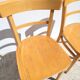 Pair of bistro chairs in light beech.