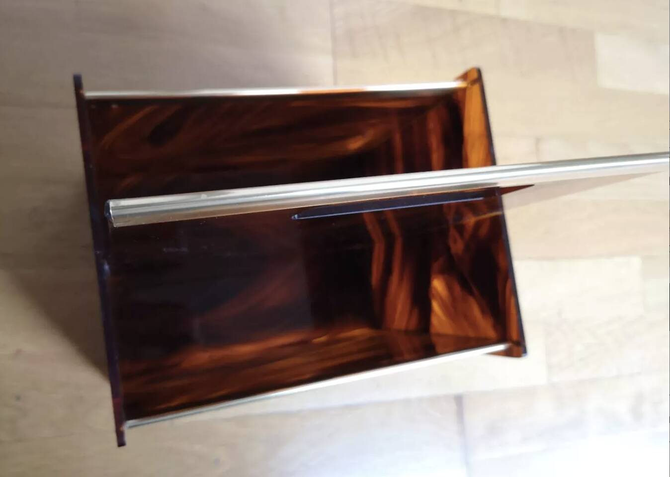 Tortoiseshell lucite magazine rack from the Christian Dior Home collection.