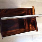 Tortoiseshell lucite magazine rack from the Christian Dior Home collection.