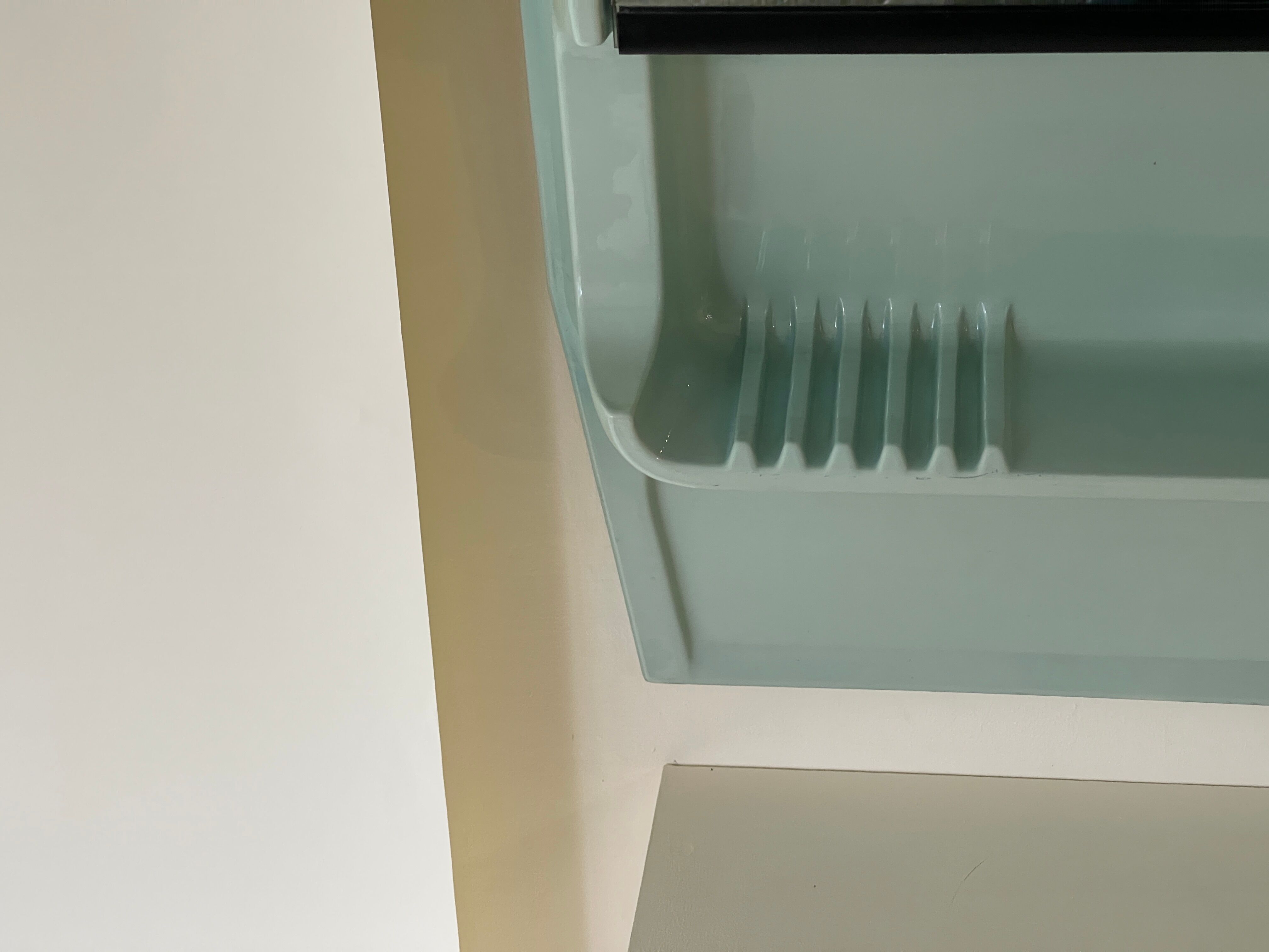 Baby blue plastic mirror and wash station