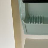 Baby blue plastic mirror and wash station