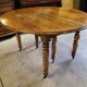 Table 6 pieds en noyer blond de 356 cm de long ouverte avec 5 allonges n10
