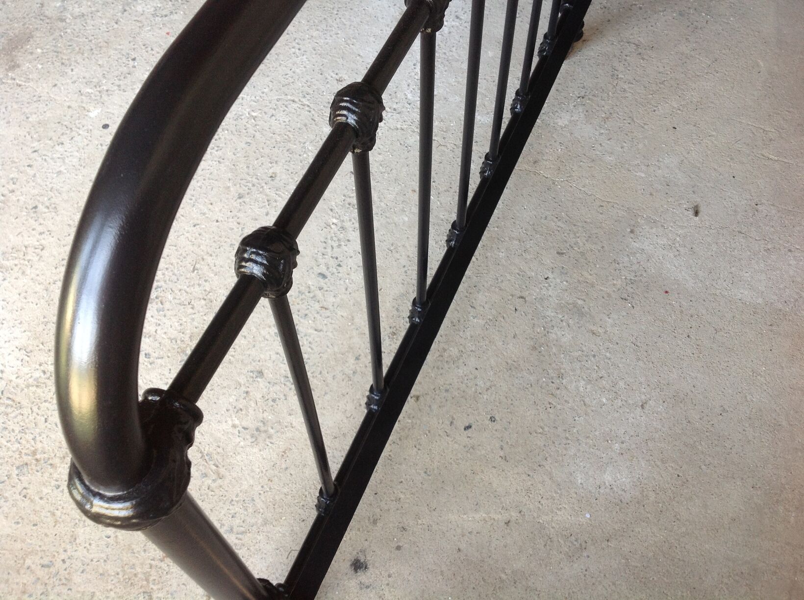 old bed with vintage painted metal bars
