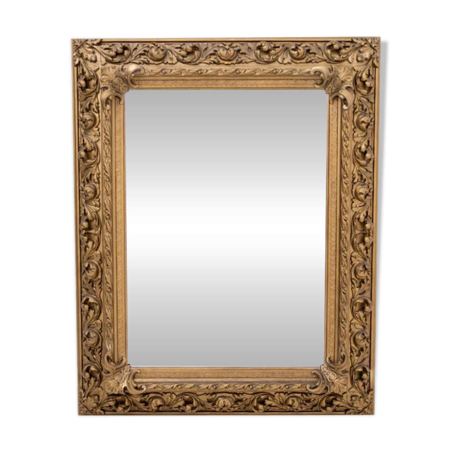 Antique mirror in richly decorated frame, France.