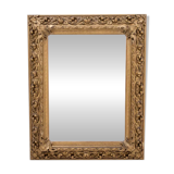 Antique mirror in richly decorated frame, France.