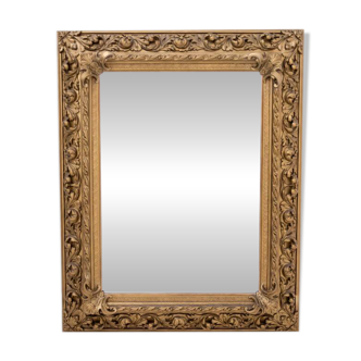 Antique mirror in richly decorated frame, France.