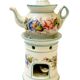 Polychrome porcelain tea pot with 20th century floral decoration