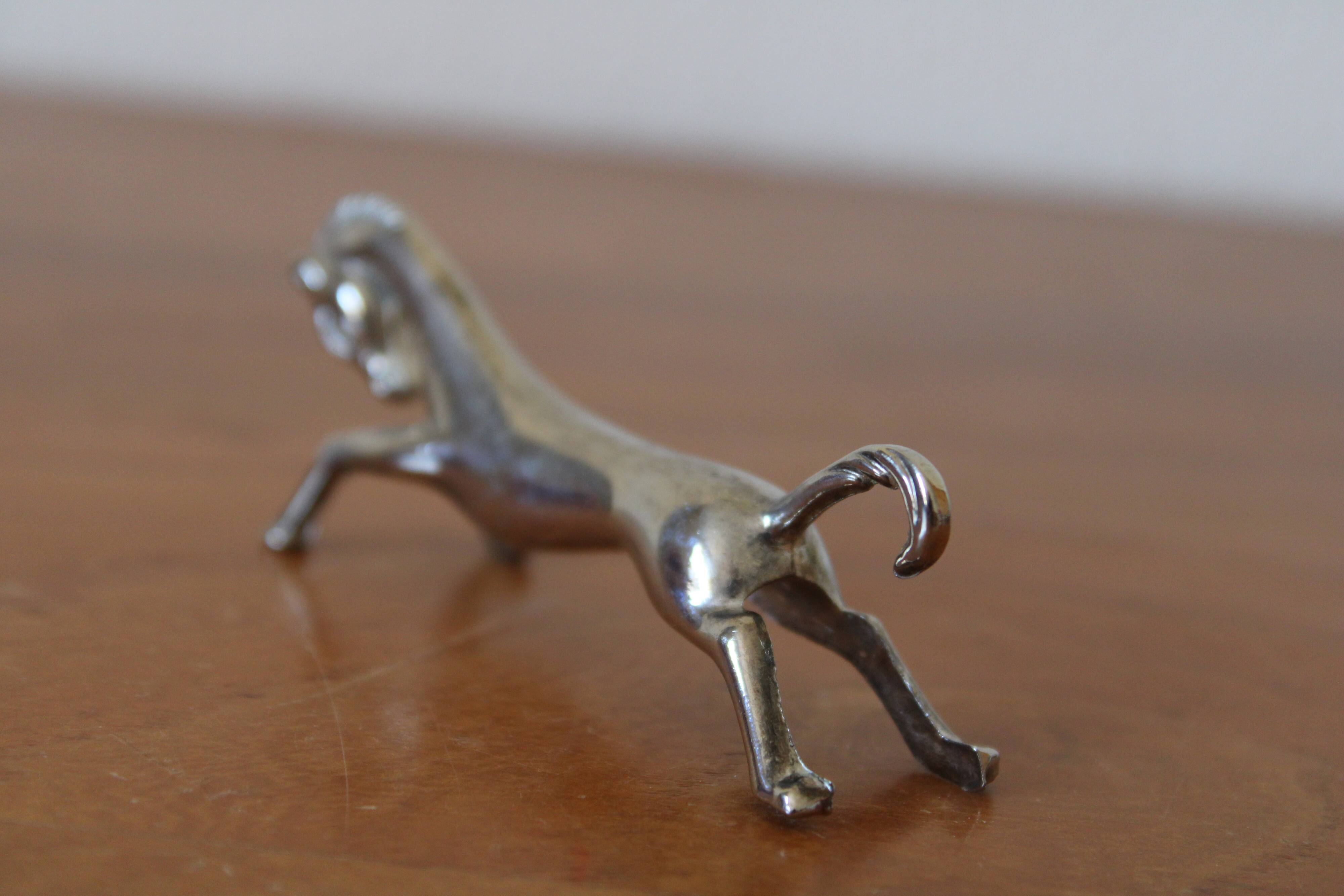 Set of 12 vintage knife rests, in silver metal