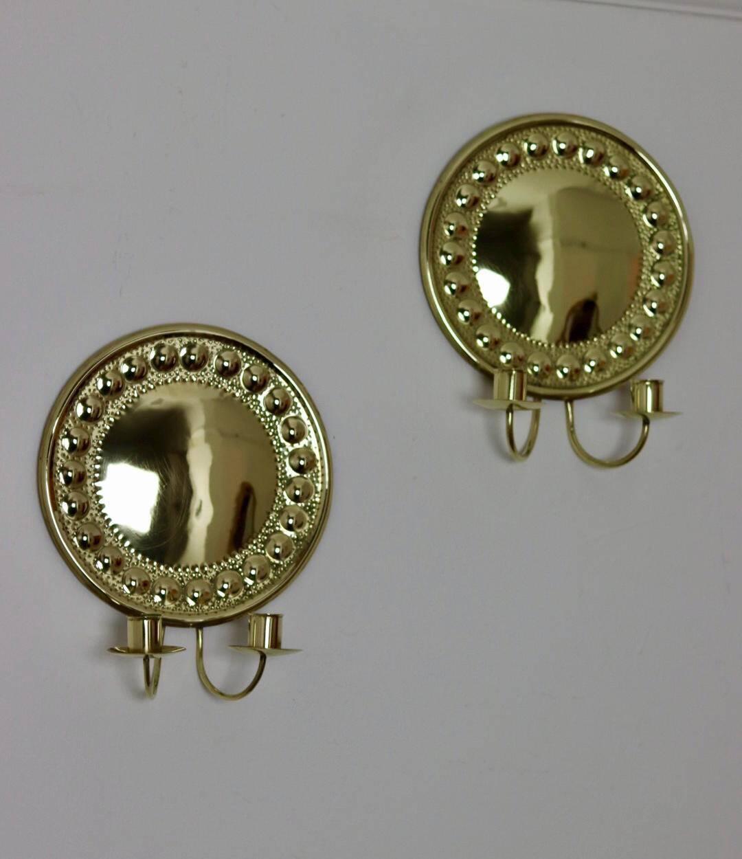 A pair of Swedish brass wall lights from the 1970s.