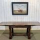 English monastery table with extensions from the late 19th century in elm and oak.