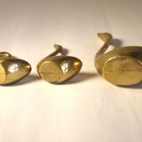 Trio of brass swans