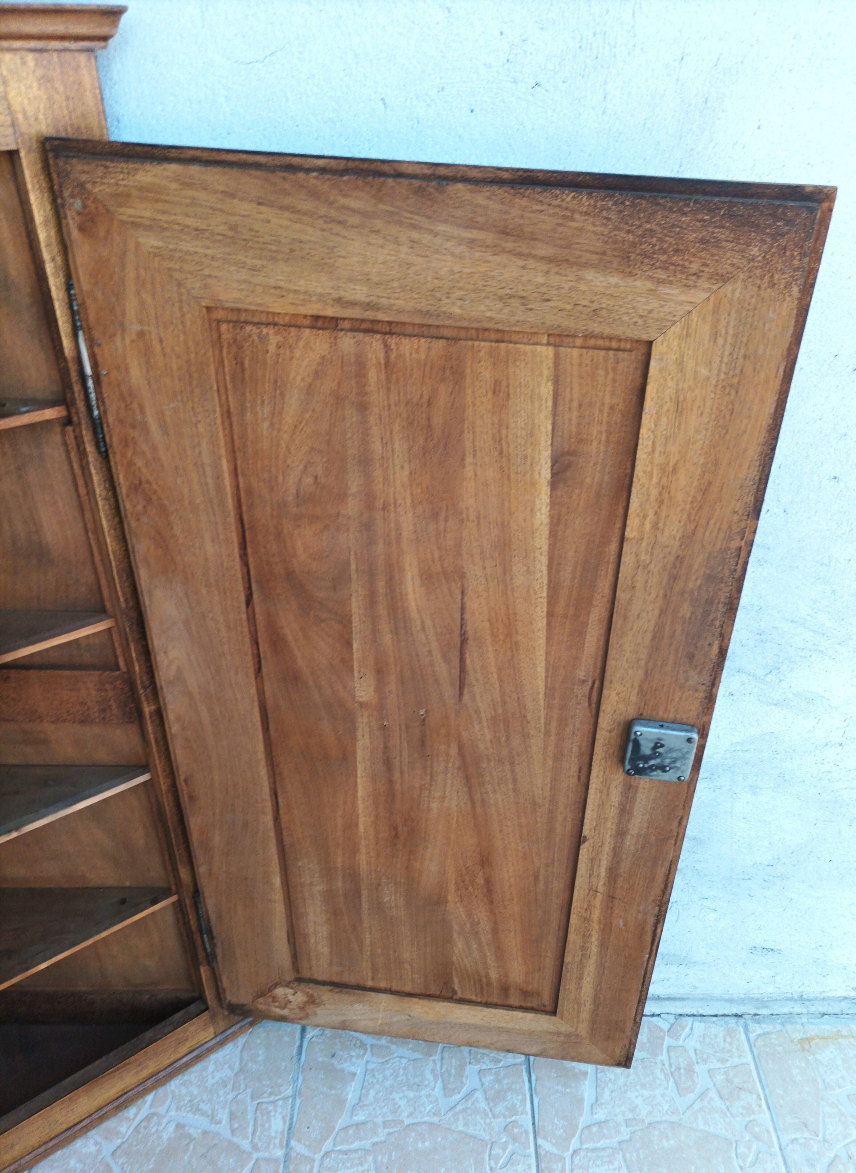 Corner cabinet in carved walnut, Savoyard style.