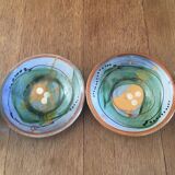 Two cups and their hand-painted ceramic saucer