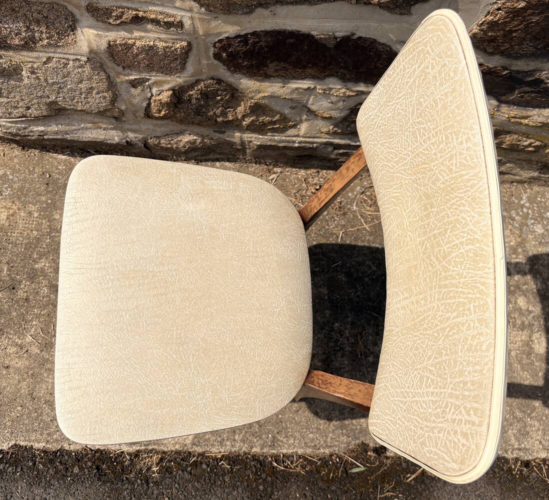 Pair of vintage chairs with upholstered backrest and seat, 1950s style.
