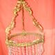 circular chandelier with a brass frame equipped with crystal drops